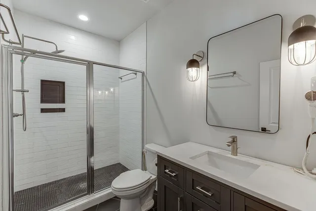 a backyard of a house with table and chairs