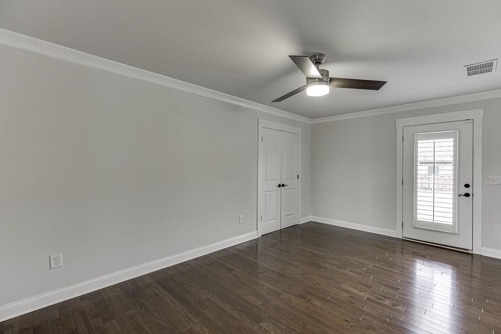 861 Bailey Woods Road Dacula, GA 30019 - Photo 49 of 67 a view of empty room with wooden floor and fan