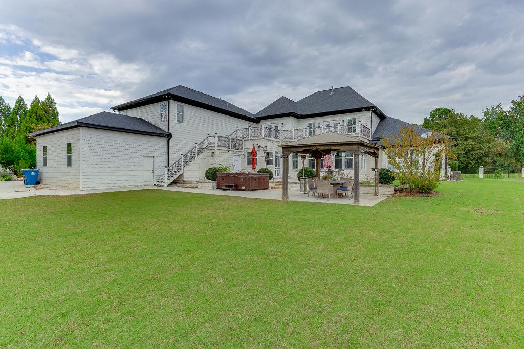 861 Bailey Woods Road Dacula, GA 30019 - Photo 60 of 67 a front view of a house with garden
