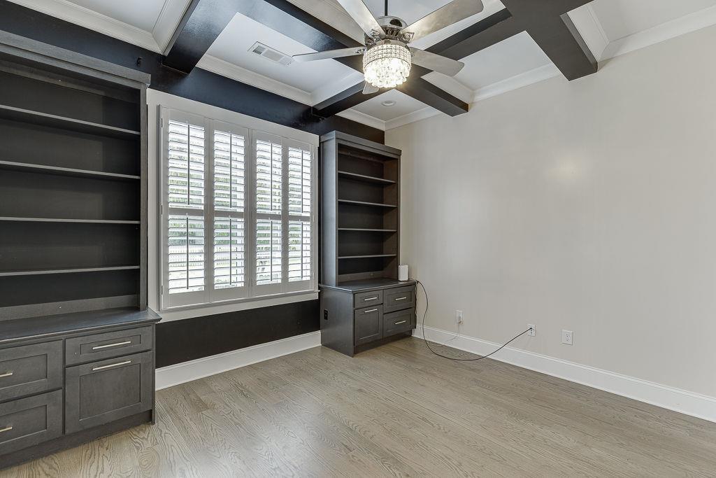 861 Bailey Woods Road Dacula, GA 30019 - Photo 6 of 67 a view of an empty room with a window and a kitchen