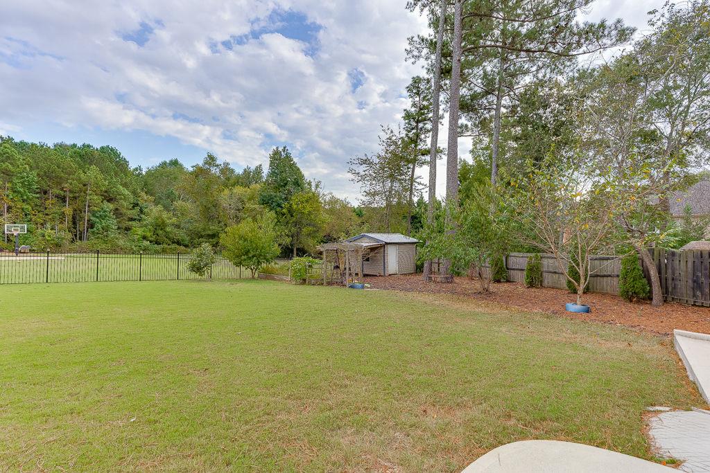 861 Bailey Woods Road Dacula, GA 30019 - Photo 61 of 67 a backyard of a house with table and chairs