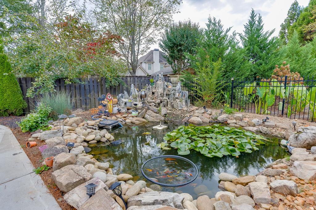 861 Bailey Woods Road Dacula, GA 30019 - Photo 62 of 67 a backyard of a house with lots of green space