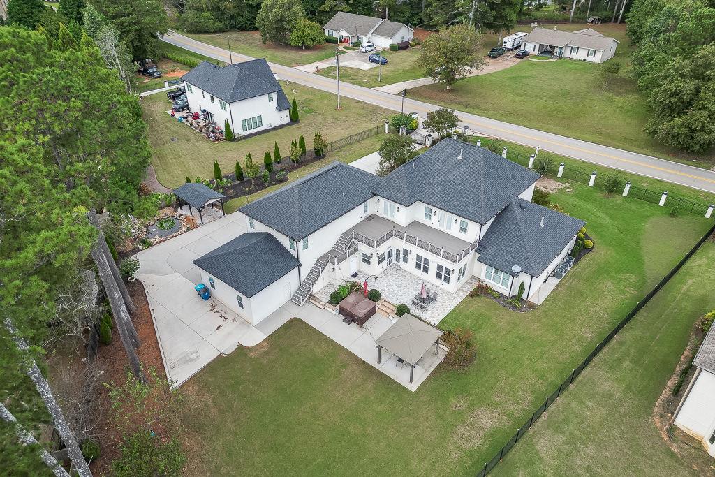 861 Bailey Woods Road Dacula, GA 30019 - Photo 64 of 67 an aerial view of residential house with outdoor space and lake view