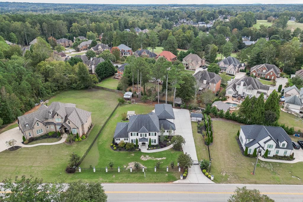 861 Bailey Woods Road Dacula, GA 30019 - Photo 66 of 67 an aerial view of a house with yard swimming pool and outdoor seating