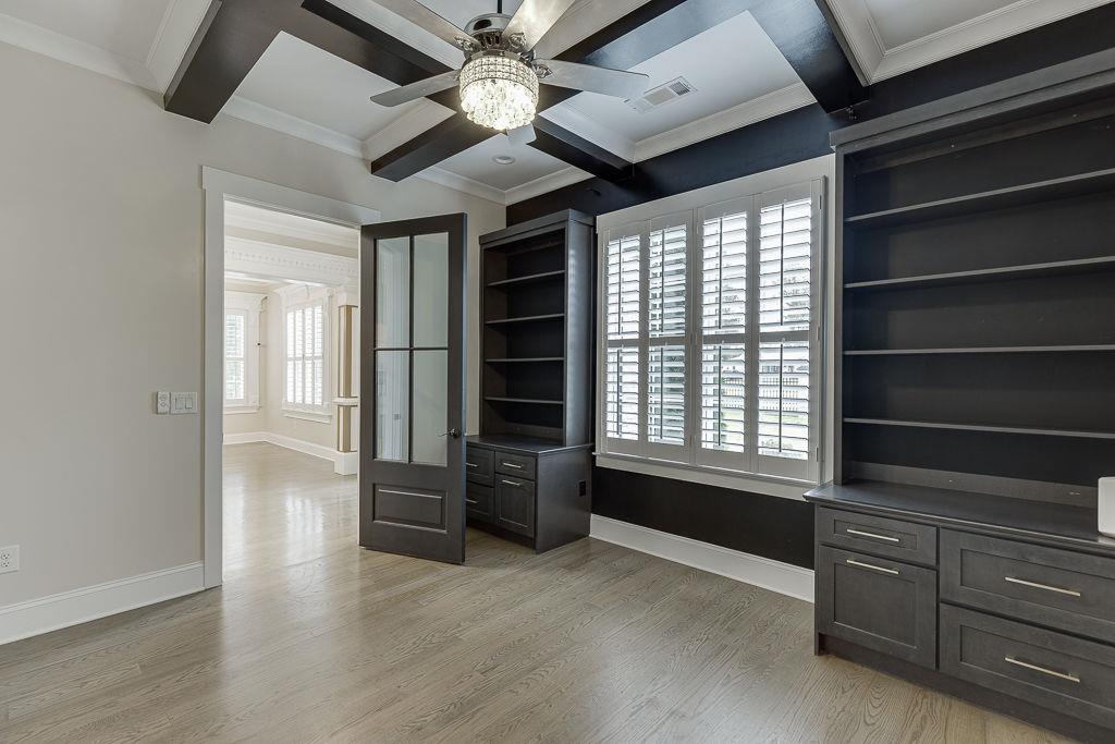 861 Bailey Woods Road Dacula, GA 30019 - Photo 7 of 67 a view of an empty room with a window and a kitchen