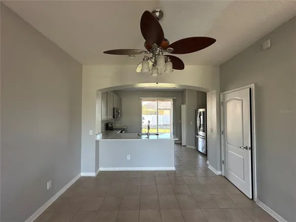 a kitchen with stainless steel appliances a refrigerator a stove a microwave a sink and cabinets