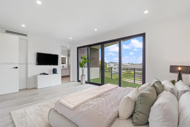 a en suite bathroom with a double vanity sink a mirror and a shower