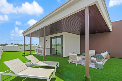 a view of a two chairs in the patio