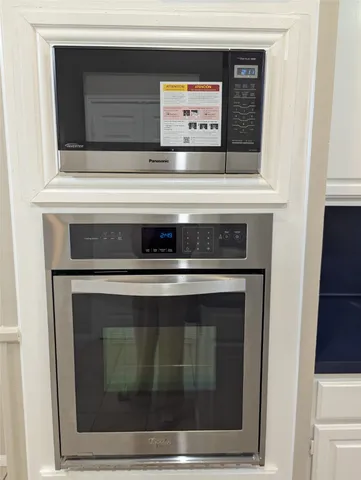 a stove top oven sitting inside of a kitchen