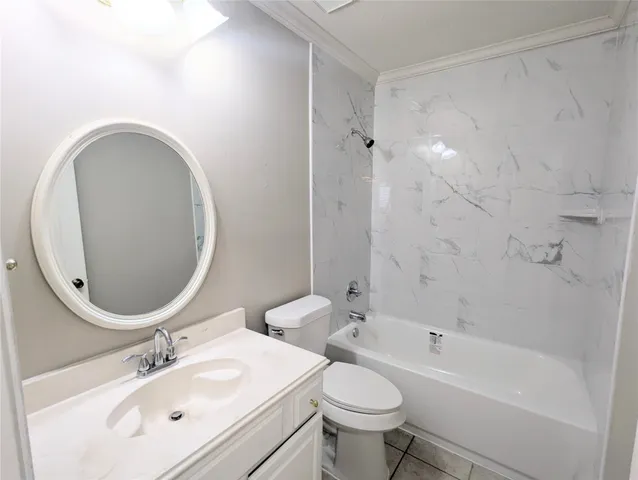 a bathroom with a sink mirror toilet and bathtub