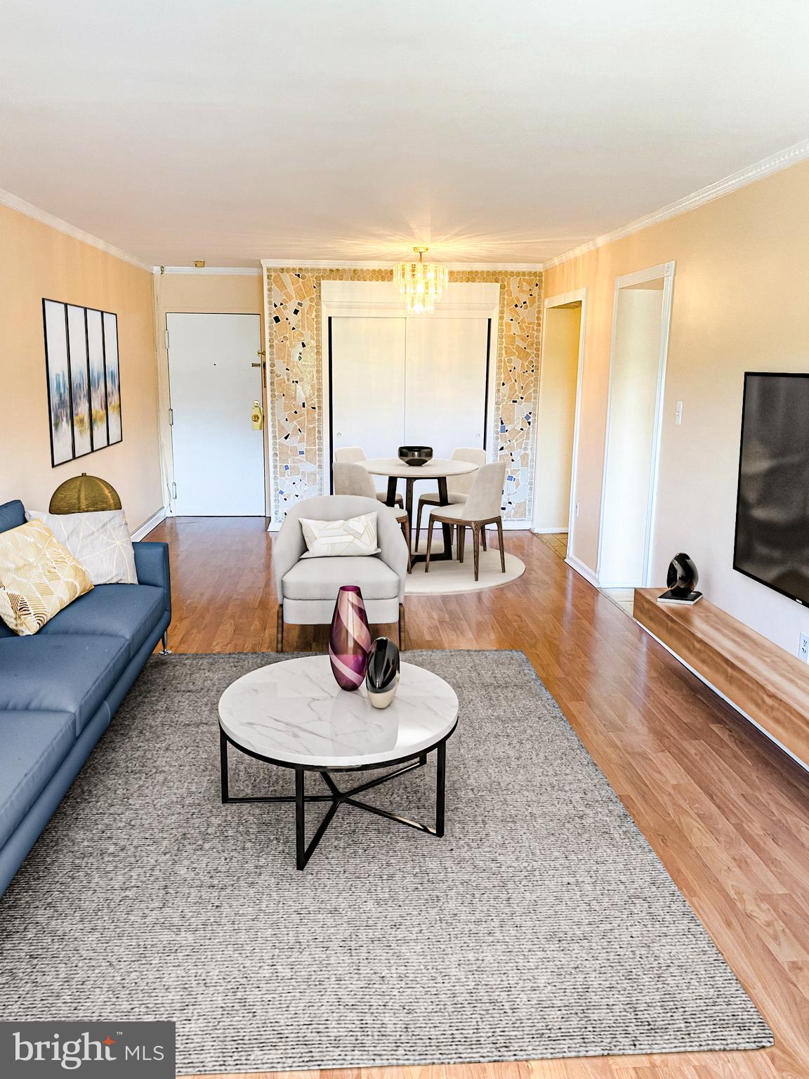9250 Edwards Way, Unit 103A Hyattsville, MD 20783 - Photo 2 of 8 a living room with furniture and a large window