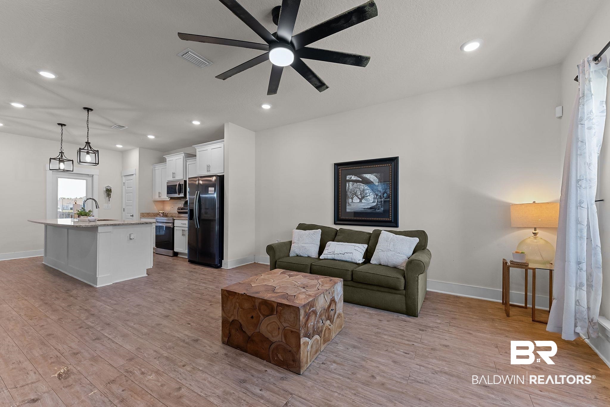 16607 Prado Loop Loxley, AL 36551 - Photo 6 of 46 Spacious open-concept living area featuring wood-finish flooring, recessed lighting, and a modern ceiling fan