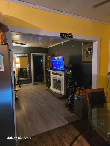 a view of a living room with a flat screen tv