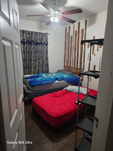 a bedroom with a bed and a table in it