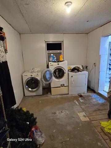 a utility room with dryer and washer