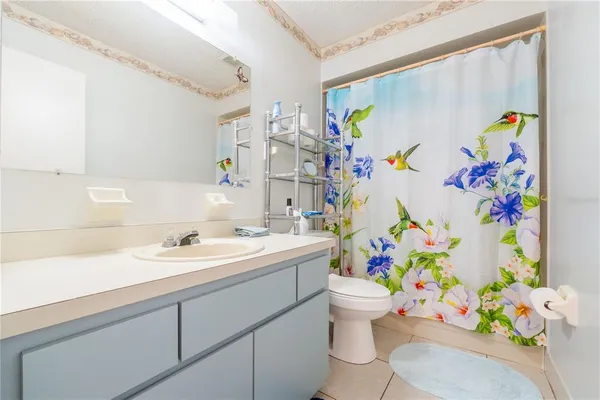 a bathroom with a sink a toilet and bathtub