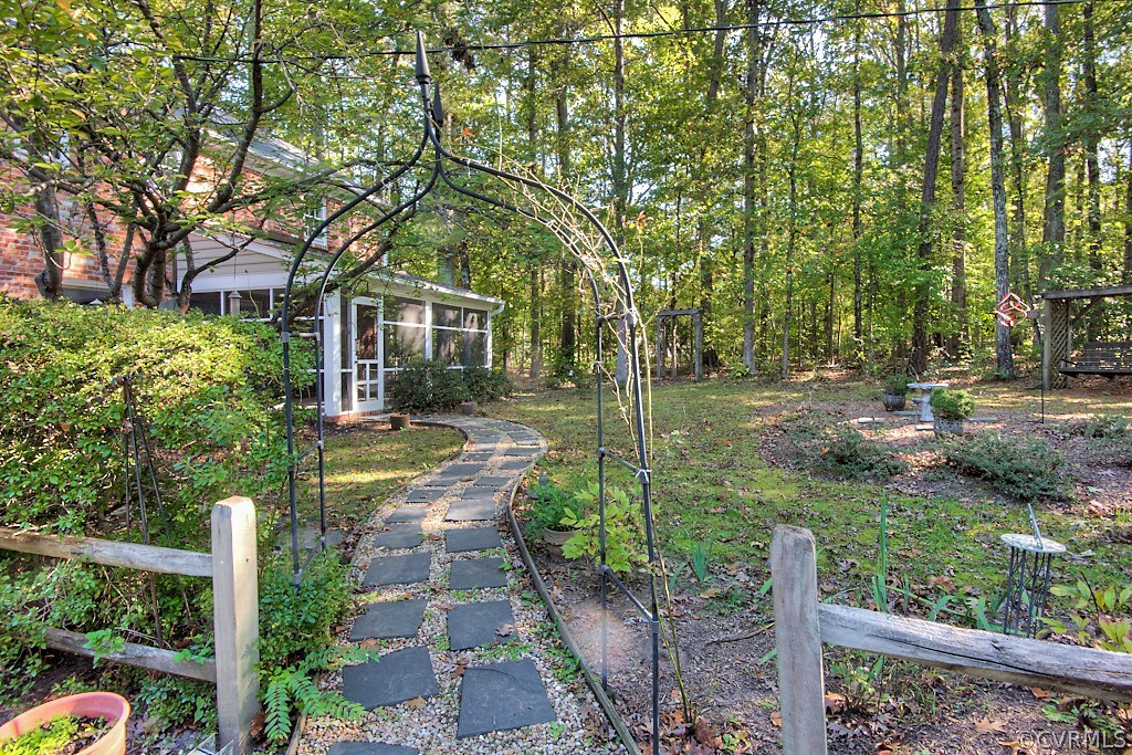 10021 Apache Road Richmond, VA 23235 - Photo 12 of 42 a front view of a house with garden