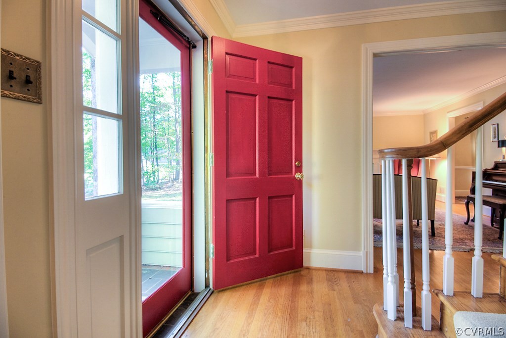 10021 Apache Road Richmond, VA 23235 - Photo 13 of 42 a view of front door with a red door and a rug