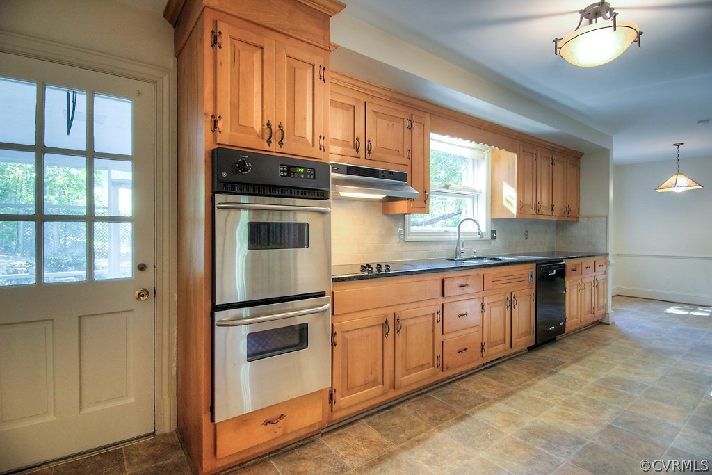 10021 Apache Road Richmond, VA 23235 - Photo 19 of 42 a kitchen with granite countertop stainless steel appliances and window