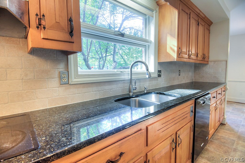 10021 Apache Road Richmond, VA 23235 - Photo 21 of 42 a kitchen with granite countertop stainless steel appliances a sink window and cabinets