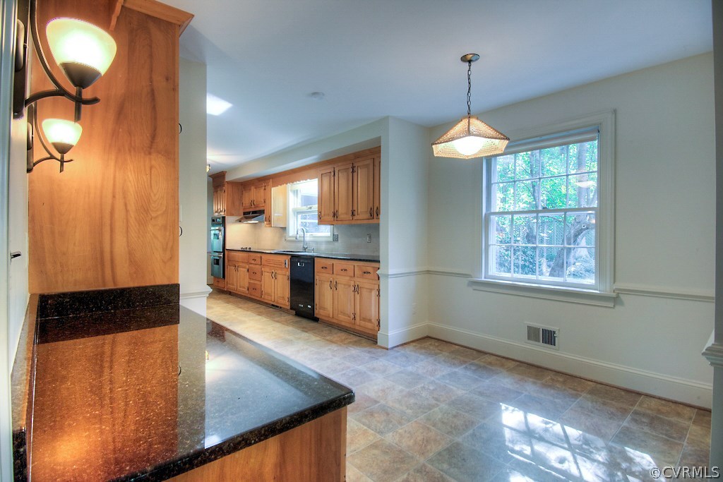 10021 Apache Road Richmond, VA 23235 - Photo 23 of 42 a view of a kitchen with a sink and a window