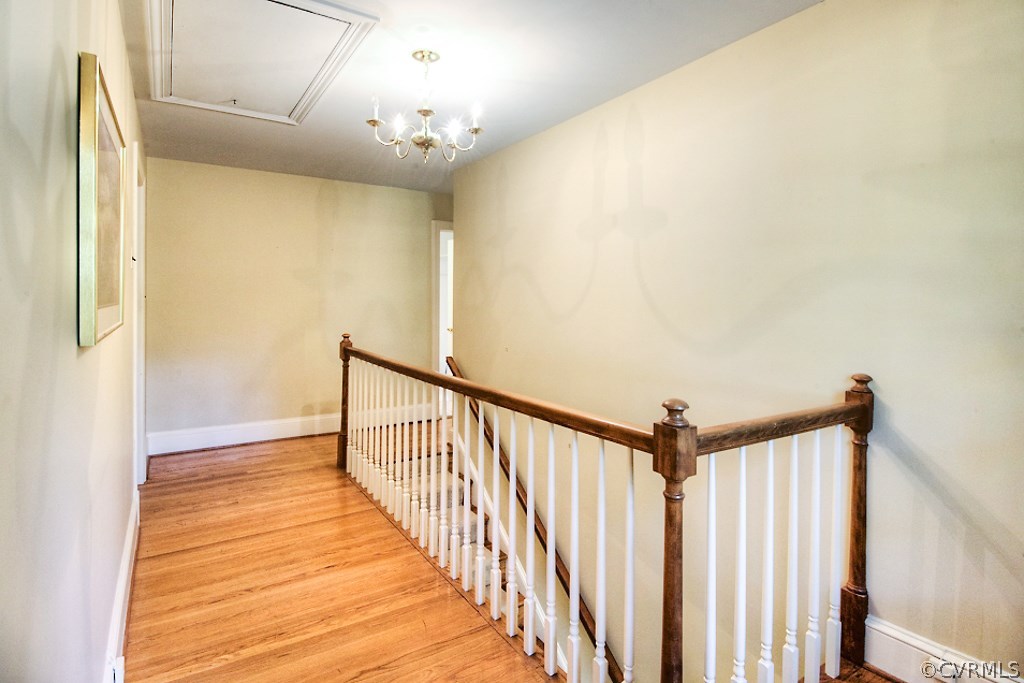 10021 Apache Road Richmond, VA 23235 - Photo 30 of 42 a view of a hallway with wooden floor and staircase