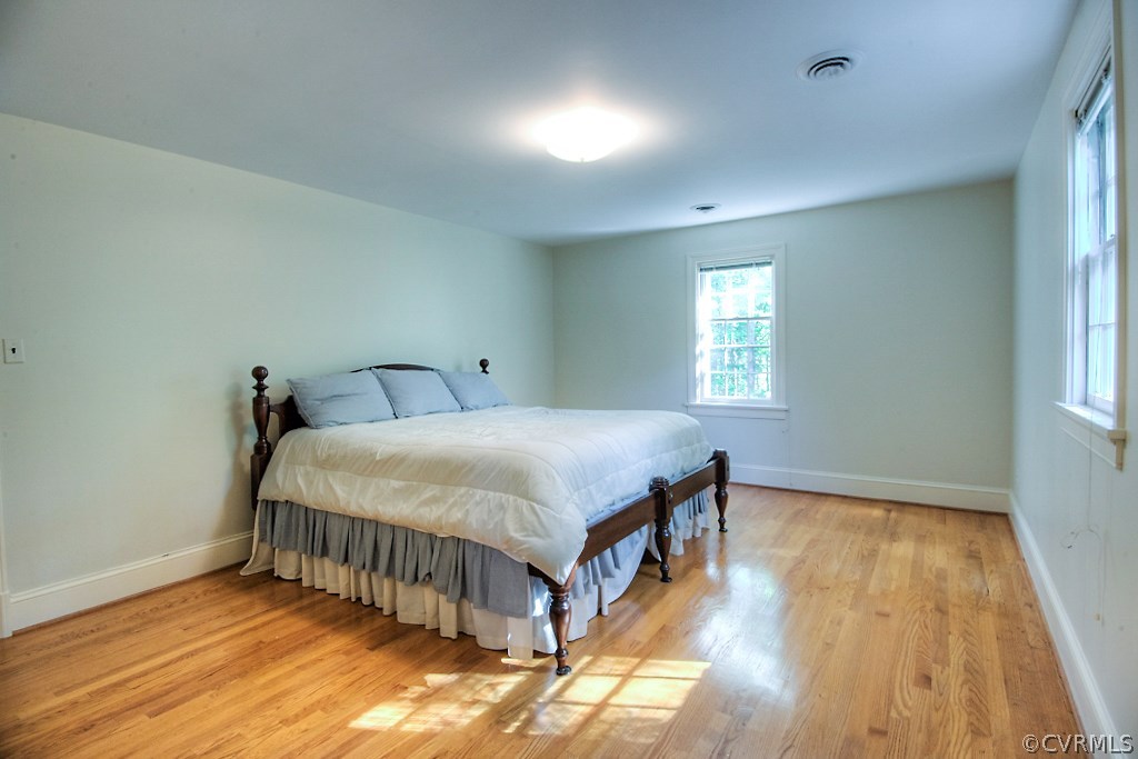 10021 Apache Road Richmond, VA 23235 - Photo 34 of 42 a bedroom with a bed and window