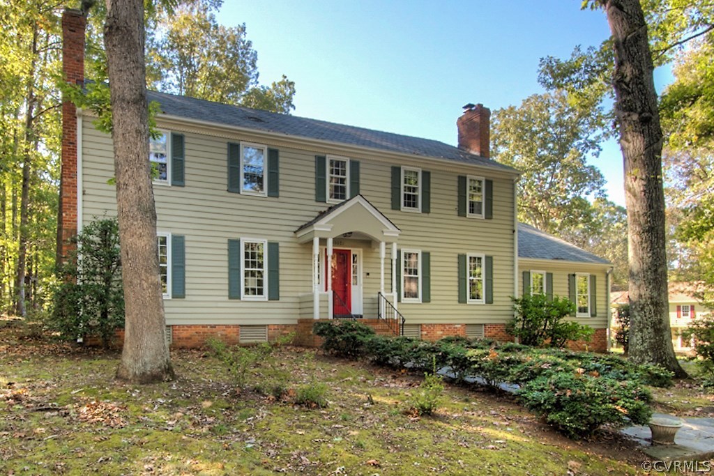 10021 Apache Road Richmond, VA 23235 - Photo 5 of 42 a front view of a house with a yard garage and outdoor seating