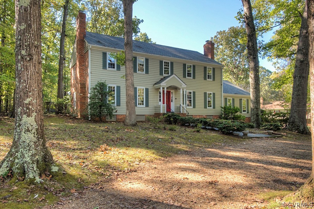 10021 Apache Road Richmond, VA 23235 - Photo 6 of 42 a front view of a house with garden