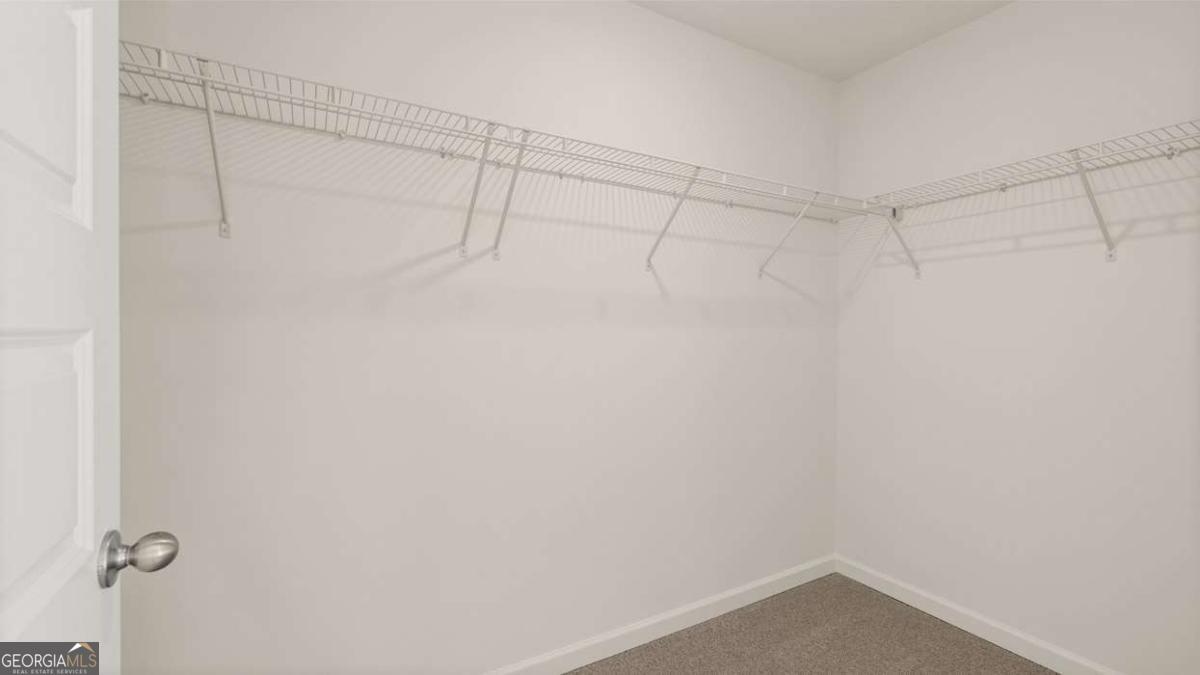 11929 Aukerman Way Hampton, GA 30228 - Photo 11 of 13 a view of a room with racks on the wall