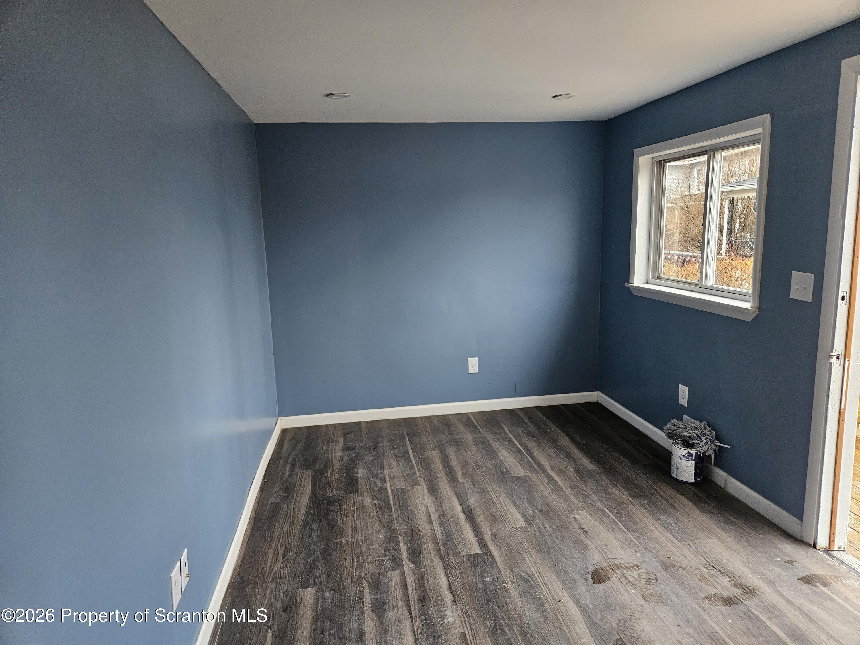 335 Phelps Street, Unit 2 REAR Scranton, PA 18509 - Photo 6 of 13 an empty room with wooden floor and windows