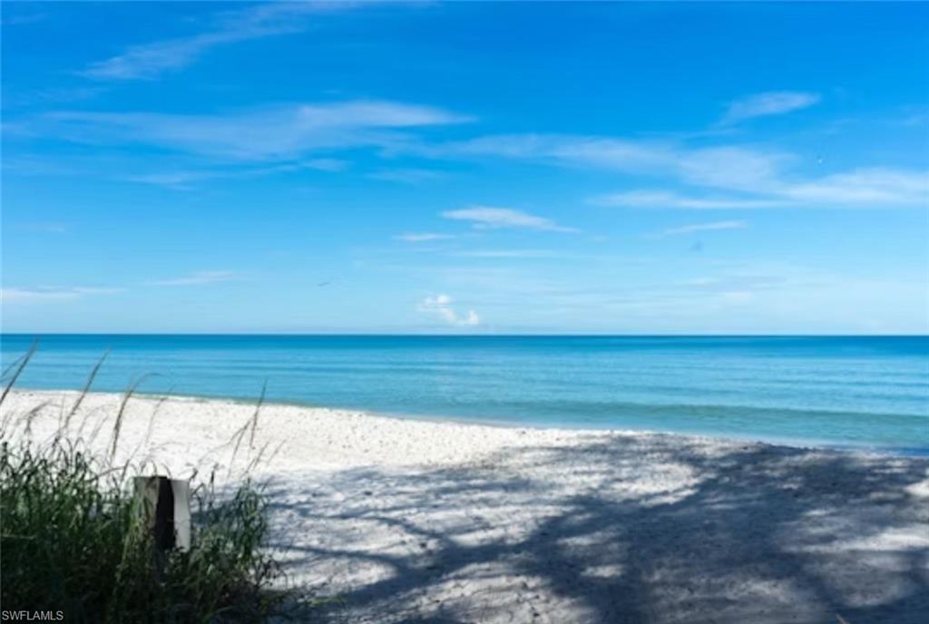 4021 Full Moon Court Naples, FL 34112 - Photo 16 of 23 a view of a room with wooden floor and windows