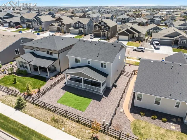 a bedroom with a bed and a ceiling fan