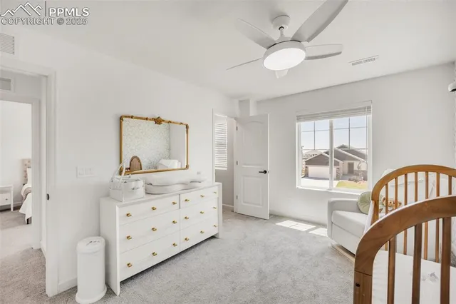 a bathroom with a sink vanity mirror and toilet