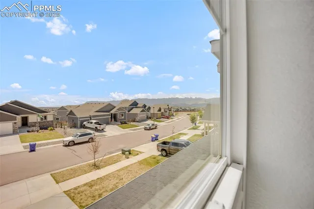 a view of room with window and ceiling fan