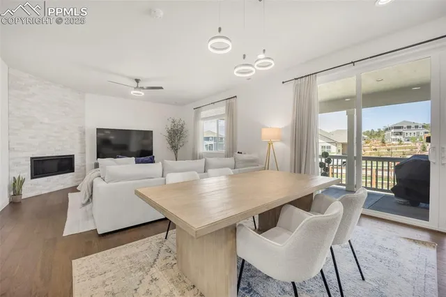 a view of a dining room with furniture window and wooden floor