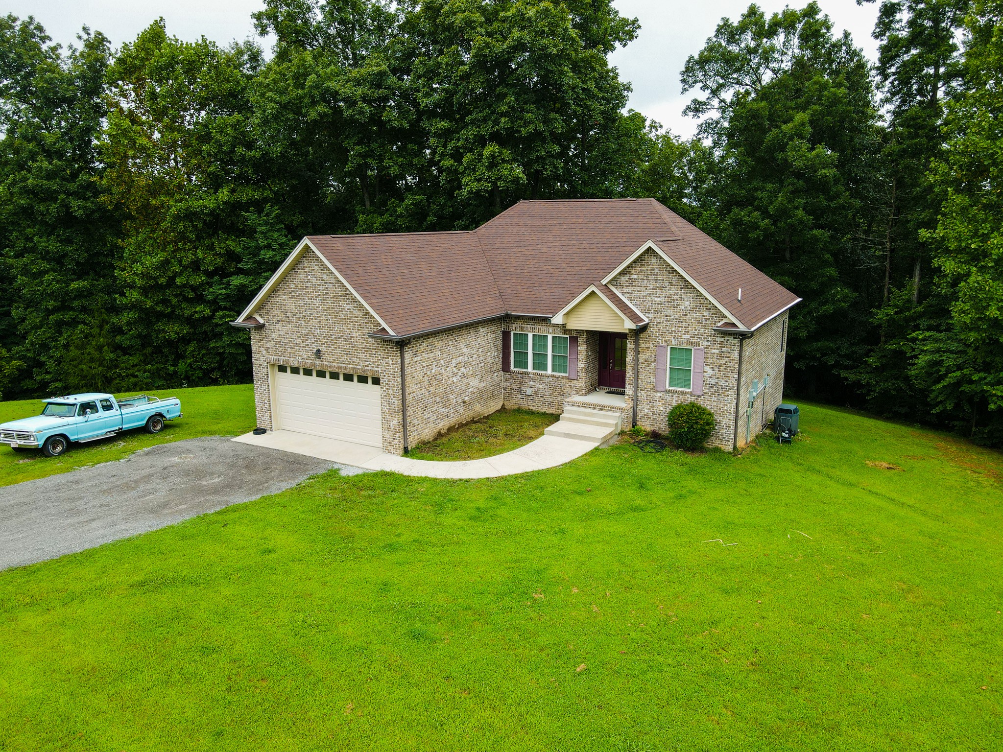 4605 Cole Ridge Road Beechgrove, TN 37018 - Photo 2 of 30 a aerial view of a house with swimming pool next to a big yard