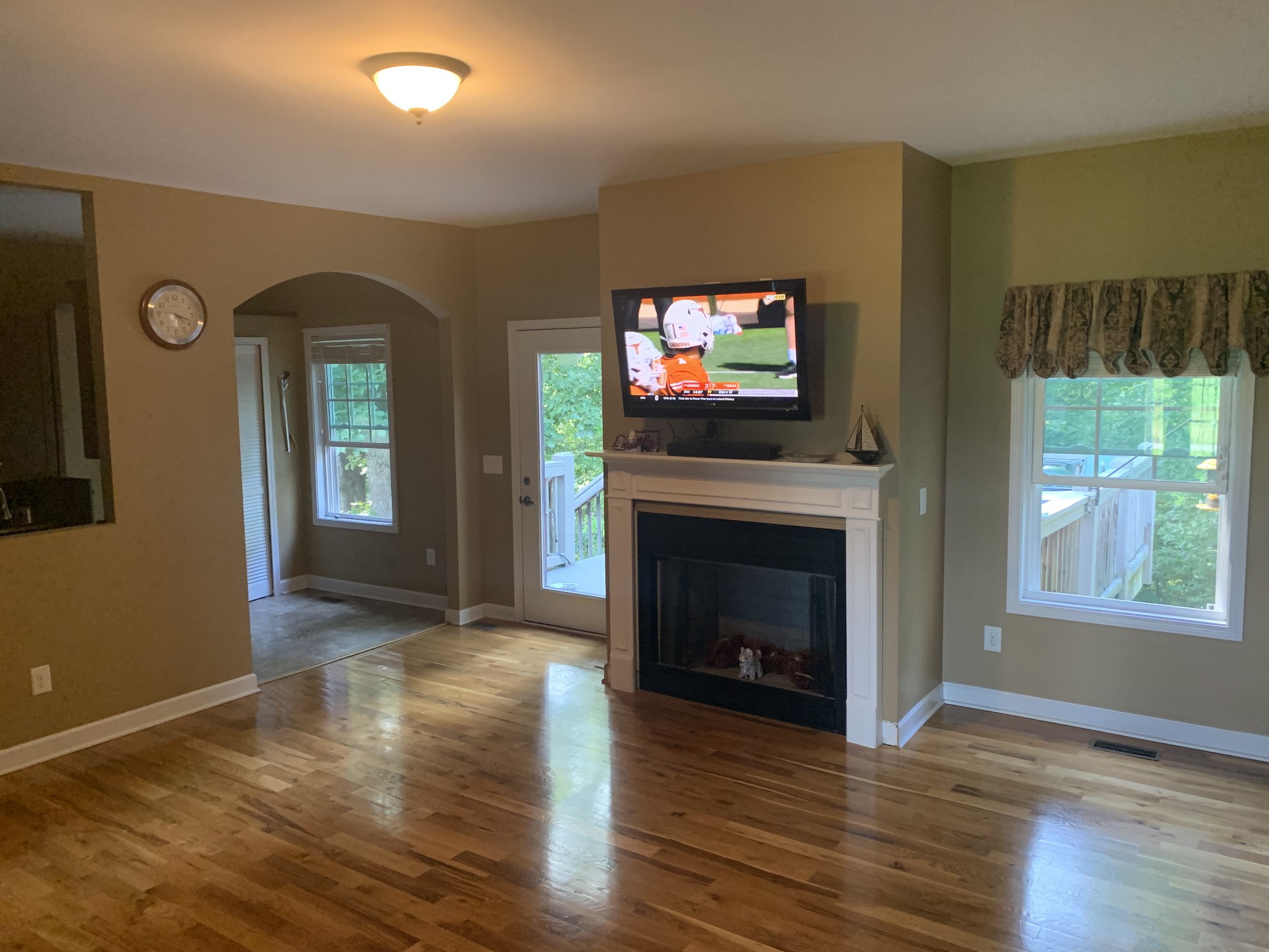 4605 Cole Ridge Road Beechgrove, TN 37018 - Photo 11 of 30 a view of a livingroom with wooden floor a fireplace and windows