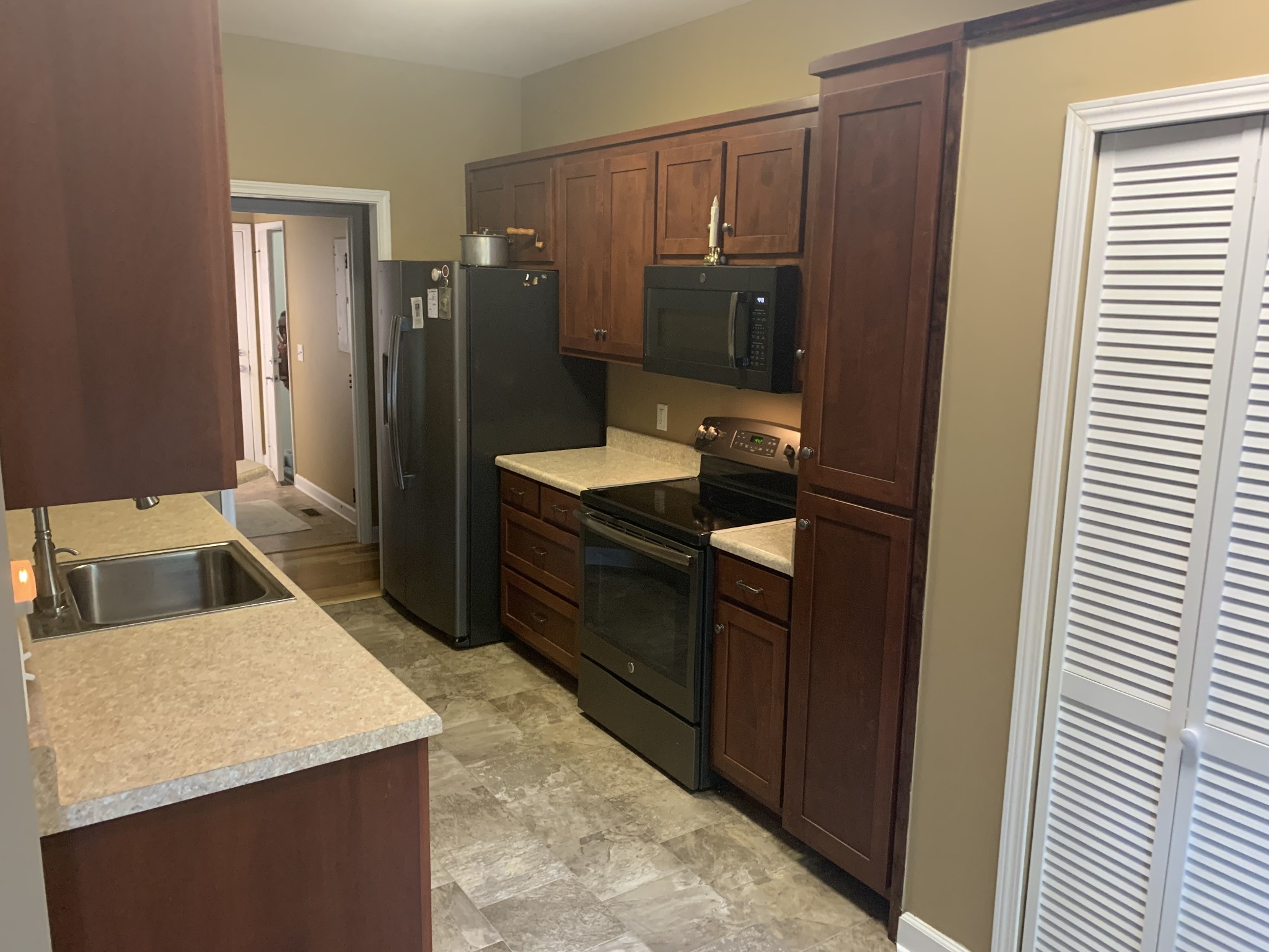 4605 Cole Ridge Road Beechgrove, TN 37018 - Photo 13 of 30 a kitchen with a refrigerator sink and cabinets
