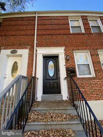 a front view of a house with parking