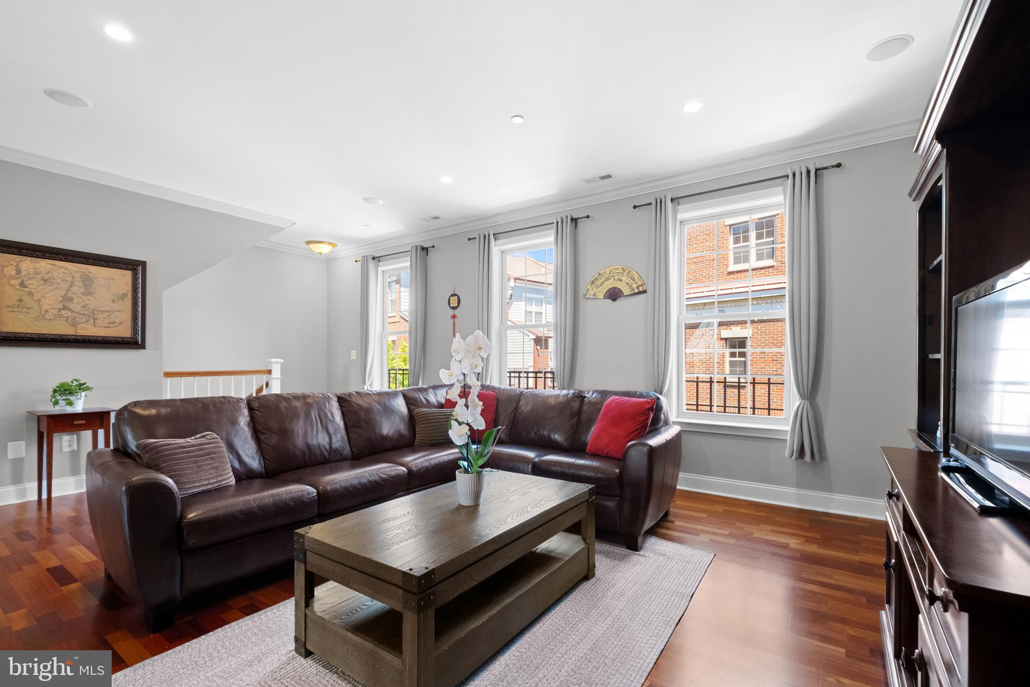 203 Captains Way Philadelphia, PA 19146 - Photo 2 of 58 a living room with furniture flat screen tv and a window
