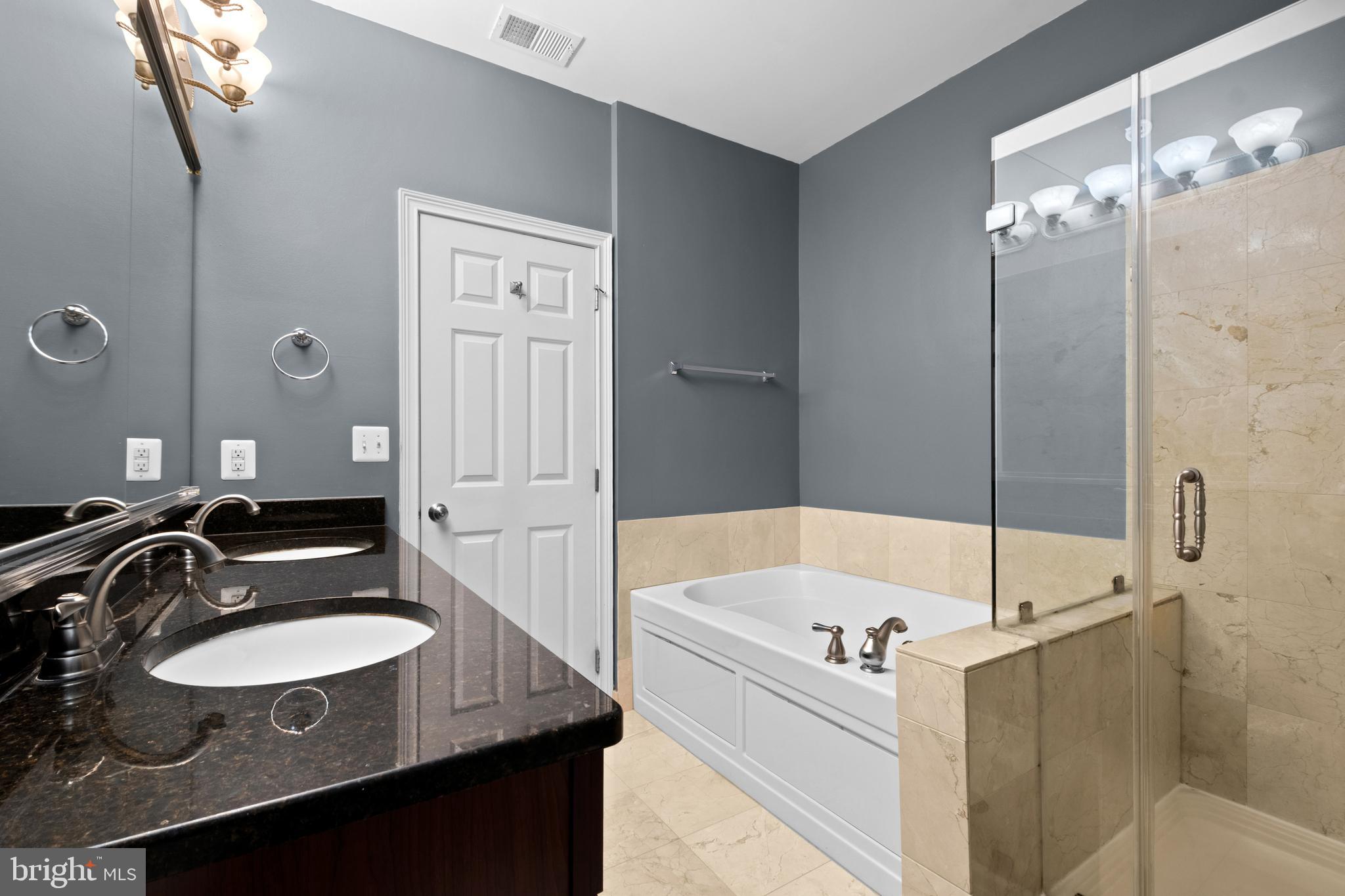 203 Captains Way Philadelphia, PA 19146 - Photo 29 of 58 a bathroom with a sink and a mirror