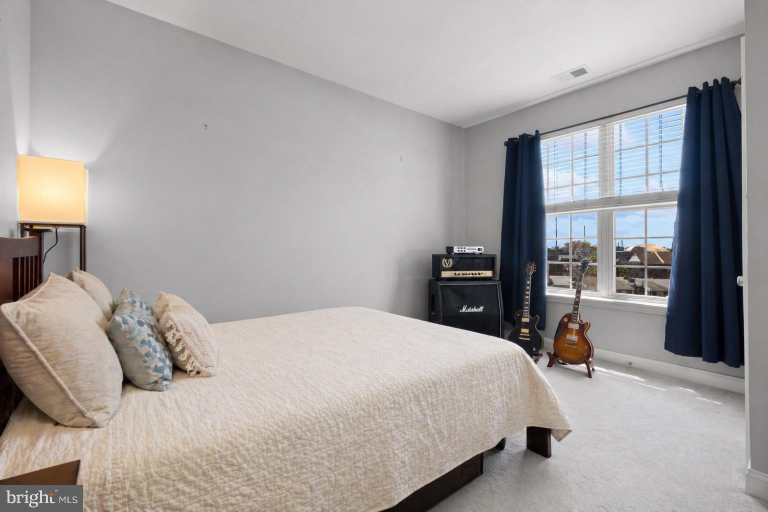203 Captains Way Philadelphia, PA 19146 - Photo 31 of 58 a bedroom with a bed and a window