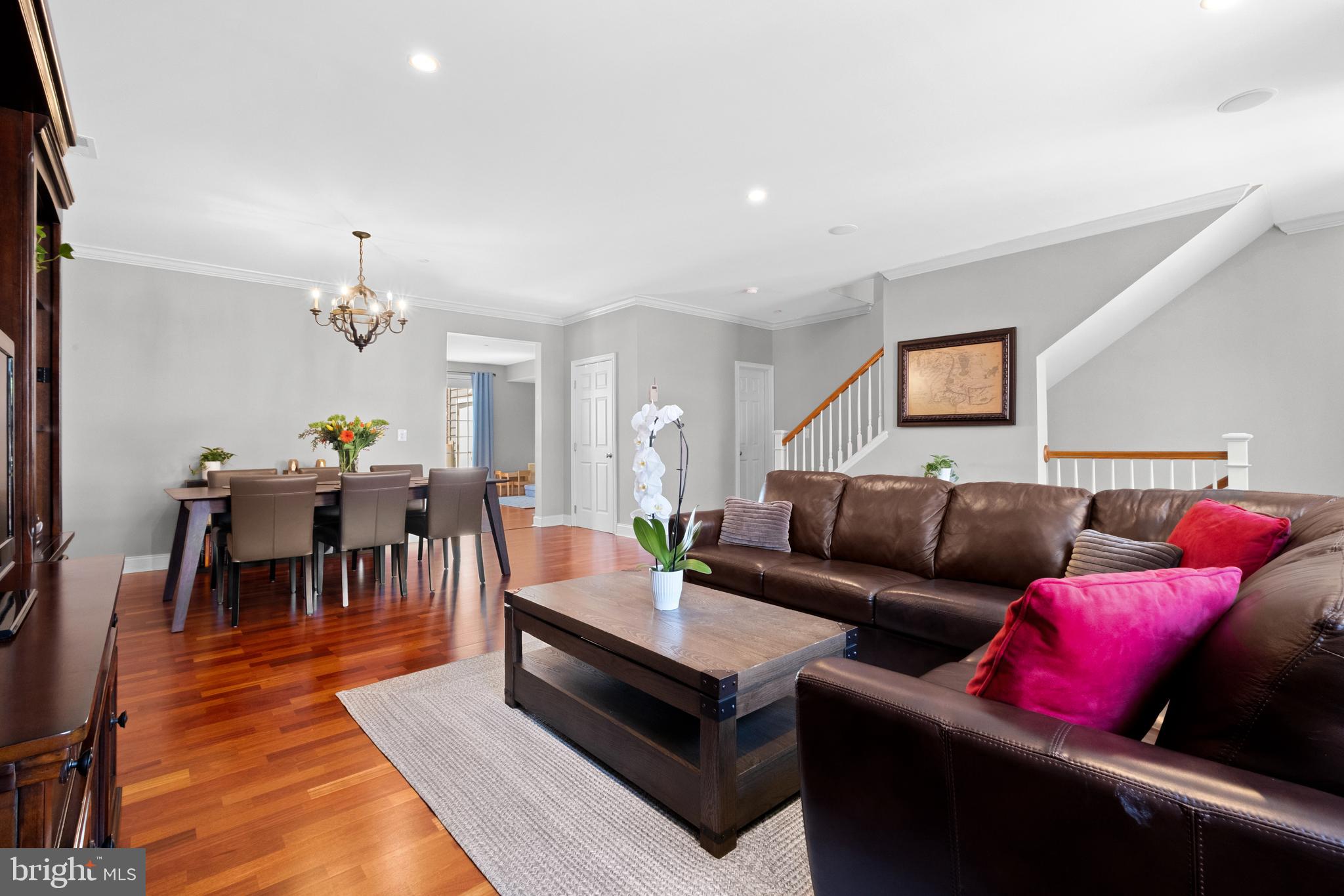 203 Captains Way Philadelphia, PA 19146 - Photo 4 of 58 a living room with furniture a rug and a chandelier