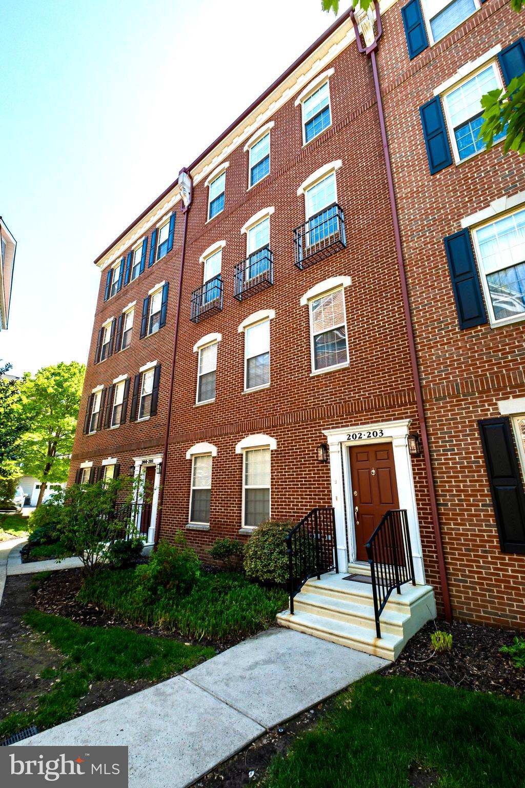 203 Captains Way Philadelphia, PA 19146 - Photo 41 of 58 a view of a brick building next to a yard