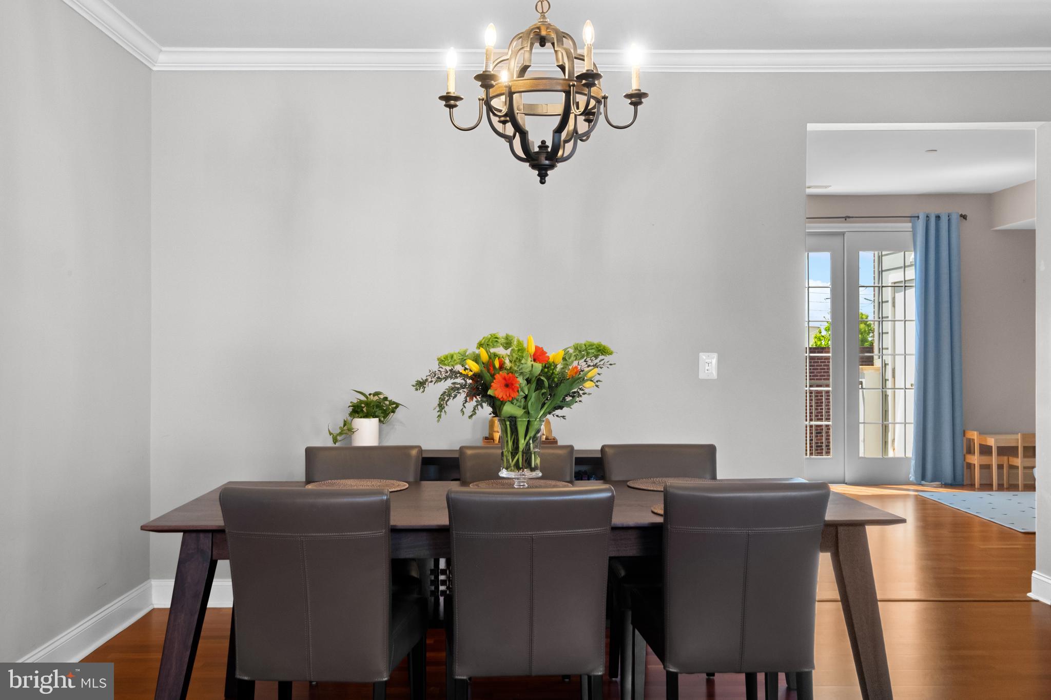 203 Captains Way Philadelphia, PA 19146 - Photo 7 of 58 a dining room with furniture potted plants and wooden floor