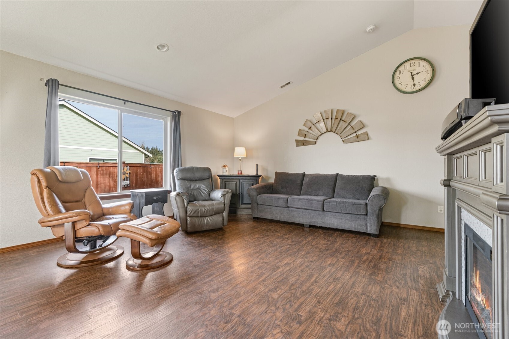 9202 180th Lane Southwest Rochester, WA 98579 - Photo 8 of 40 a living room with furniture and a fireplace
