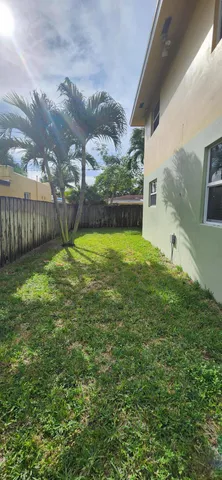 a view of a backyard of the house