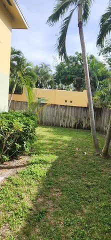 a view of yard with large tree