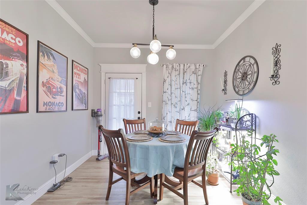 7329 Mountain View Road Abilene, TX 79602 - Photo 13 of 33 a view of a dining room with furniture and a chandelier